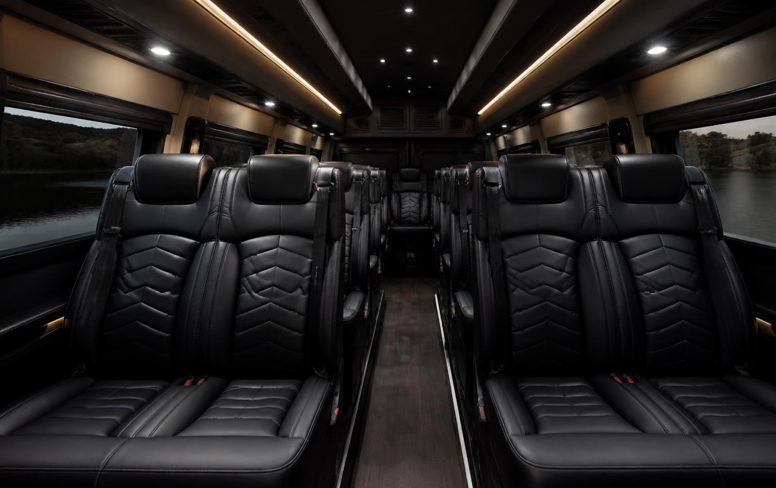 Interior of the SwiftFlow van with black leather seating and generous legroom