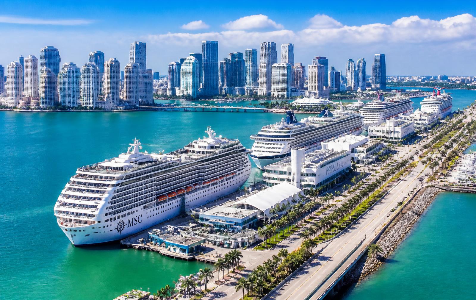 Aerial daytime view of PortMiami cruise terminals with the Miami skyline
